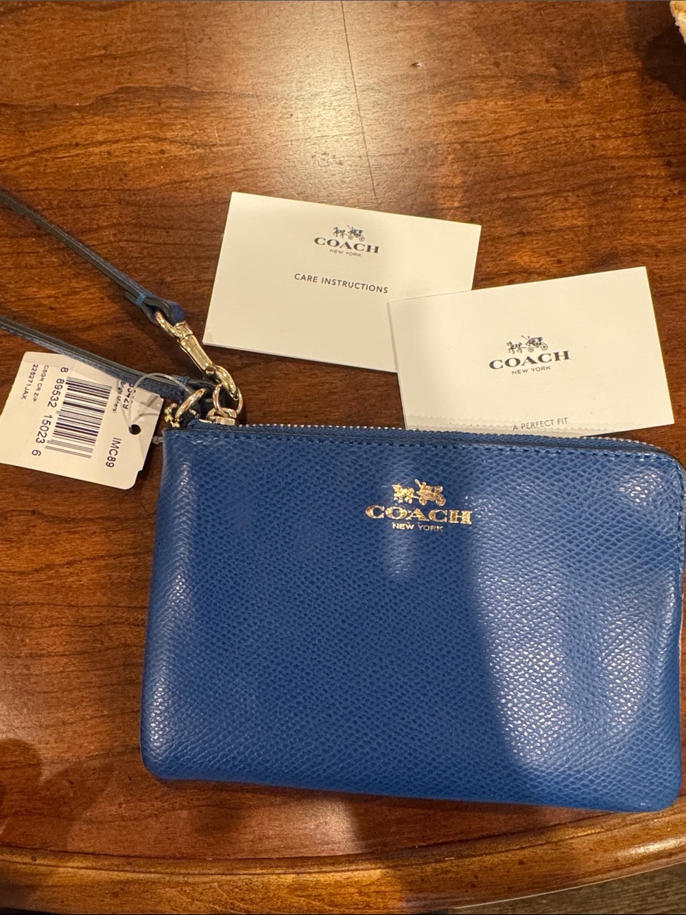 Coach Blue Pebbled Leather Wristlet with Gold Logo